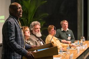 Aaron Freeman, comedian, author, teacher and well-known radio commentator, moderated the panel, “High Stakes Science Pushing Boundaries” which was held in Fermilab’s Wilson Hall. <a href="https://www.flickr.com/photos/55960689@N04/sets/72157650398910655/">View photos from the event.</a> Aaron Freeman, comedian, author, teacher and well-known radio commentator, moderated the panel, “High Stakes Science Pushing Boundaries” which was held in Fermilab’s Wilson Hall. <a href="https://www.flickr.com/photos/55960689@N04/sets/72157650398910655/">View photos from the event.</a>